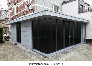 New Modern Extension Of A House With Big Glasses Windows And Doors