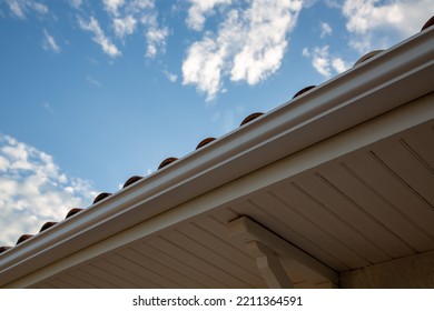 New Modern House With Gutter Roof Wall Under Blue Cloud Sky