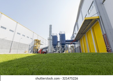 New modern industrial waste plant pipelines from the outside. Waste-to-energy plant.  Produces a combustible fuel commodity, such as methane, methanol, ethanol and synthetic fuels.