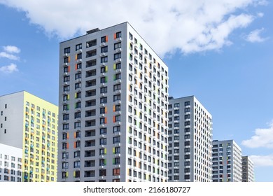New modern monolithic residential apartment buildings on blue cloudy sky - Shutterstock ID 2166180727
