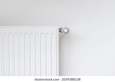 New Modern Radiator Against White Copy Space Wall. Central Heating System In Contemporary House. Saving Energy, Consumption Of Natural Resource And Warm Home Concept