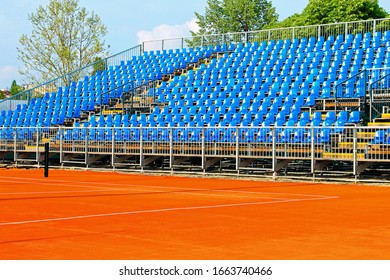 New Modern Tennis Court With Blue Stands 
