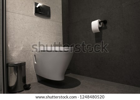 New modern toilet bowl in bathroom interior. Space for text