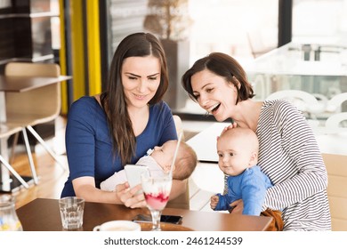 New mom friends going to cafe with babies. Spending free time during maternity leave together in city. - Powered by Shutterstock