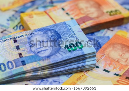 New money,currency of South African on business concept.Focus on eye of a man on banknote