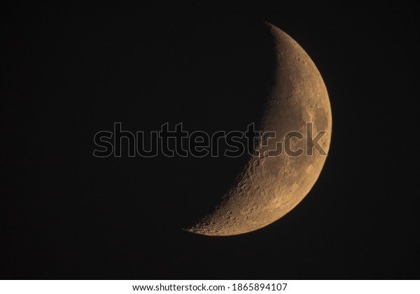 New Moon On A Black Night Sky Background. Waxing\
Crescent Moon With Craters
