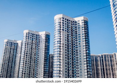 New multistorey residential round building. Modern house of blue and white glass colors. Contemporary architecture facade exterior - Powered by Shutterstock