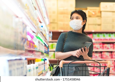 New Normal After Covid Epidemic Young Smart Asian Female Shopping New Lifestyle In Supermarket With Face Shild Or Mask Protection Hand Choose Consumer Products New Normal Lifestyle