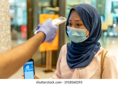 New Normal Concept, Cute Malay Girl At The Mall For Temperature Screening