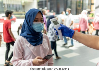 New Normal Concept, Cute Malay Girl At The Mall For Temperature Screening