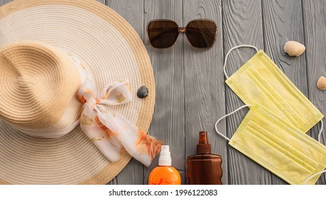 New Normal Covid Face Mask Hat Bag Sun Protection Sunglasses Sunscreen Spray Lotion Tan Ultra-violet Rays. Summer Background Template Mockup Free Space Pattern Composition Sample Text. Top View Above