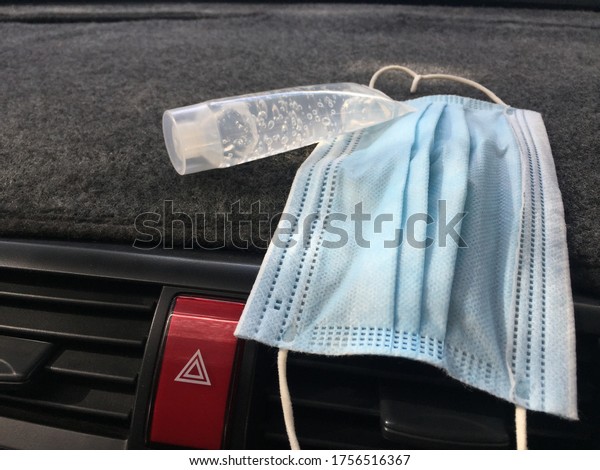 New normal, Daily necessities, Coronavirus\
covid-19, masks and hand sanitizer gel,put in the front of the car\
for hand hygiene spread\
protection