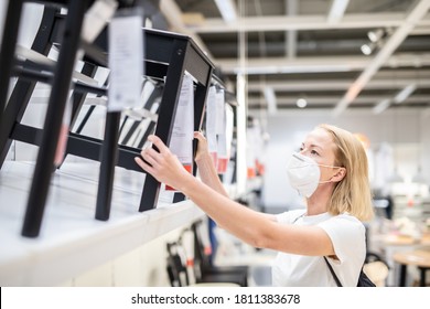 New Normal During Covid Epidemic. Caucasian Woman Shopping At Retail Furniture And Home Accessories Store Wearing Protective Medical Face Mask To Prevent Spreading Of Corona Virus.