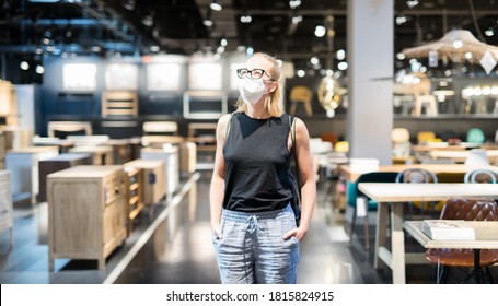 New Normal During Covid Epidemic. Caucasian Woman Shopping At Retail Furniture And Home Accessories Store Wearing Protective Medical Face Mask To Prevent Spreading Of Corona Virus.