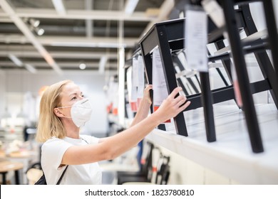 New Normal During Covid Epidemic. Caucasian Woman Shopping At Retail Furniture And Home Accessories Store Wearing Protective Medical Face Mask To Prevent Spreading Of Corona Virus.