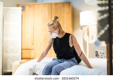 New Normal During Covid Epidemic. Caucasian Woman Shopping At Retail Furniture And Home Accessories Store Wearing Protective Medical Face Mask To Prevent Spreading Of Corona Virus.