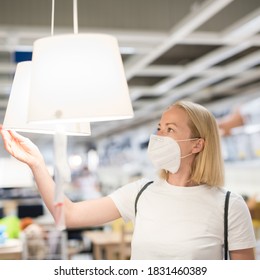 New Normal During Covid Epidemic. Caucasian Woman Shopping At Retail Furniture And Home Accessories Store Wearing Protective Medical Face Mask To Prevent Spreading Of Corona Virus.