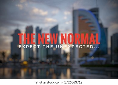 THE NEW NORMAL. EXPECT THE UNEXPECTED text on blurred background of Doha City. Coronavirus outbreak concept.