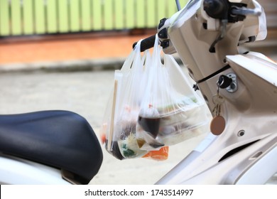 New Normal Lifestyle , Bog Pack Food Back To Home , Food In Plastic Bag Hang On Motorcycle