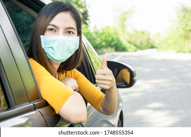 New Normal Lifestyle ,city Life Concept With Asian Female Tourism Driving A Car And Wearing Protective Mask To Travel  