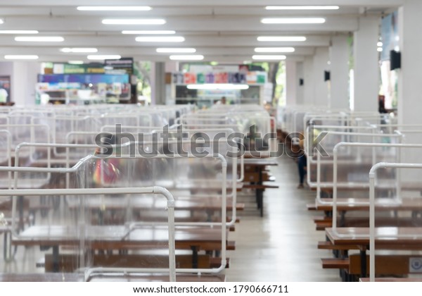 New normal lifestyle\
in Thailand by using plastic sheets divided public space In the\
school cafeteria to prevent the spread of covid-19 according social\
distancing policy