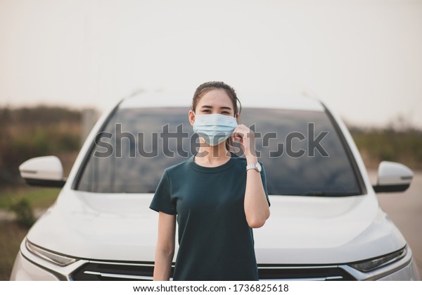 New normal people ware medical face mask everywhere\
travel car on road 