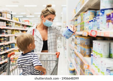 New Normal In Shopping. Young Mother Wearing Prevention Mask And Her Little Son In A Supermarket During Virus Pandemic. 