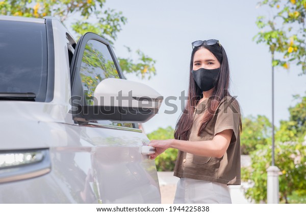New normal Women wear mask protect coronavirus\
covid19 travel by car