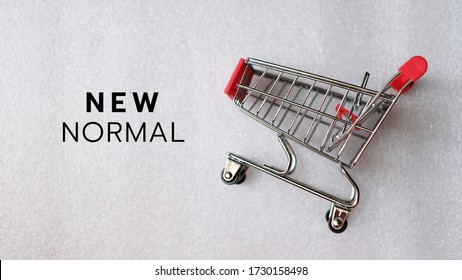 New Normal Word With Shopping Cart, Coronavirus Pandemic Concept.