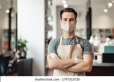 New Normal. Young Male Barber Meeting Clients In Protective Mask, Empty Space