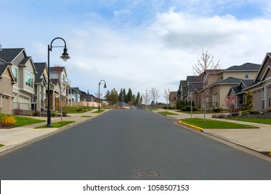 New North American suburban upscale neighborhood homes along street in Happy Valley Oregon United States - Shutterstock ID 1058507153
