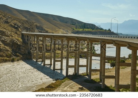 New North-South route , Bridge overpass 1000 meters canyon river Naryn, Kyrgyzstan.