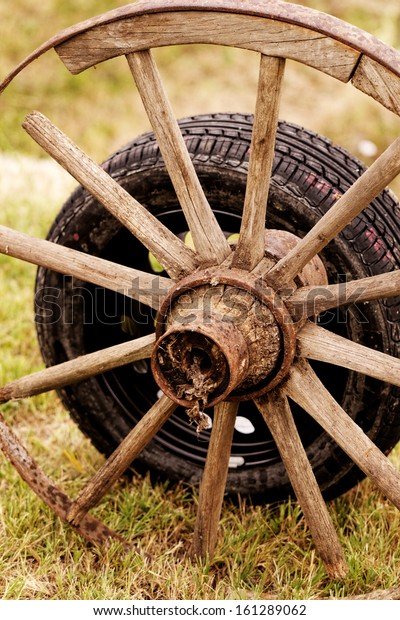 new and old broken wagon
(car) wheel