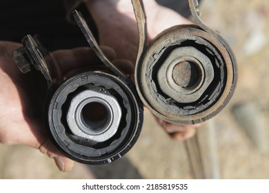 New and old torn silent blocks with metall sleeves close up. Car suspension arm repair - Shutterstock ID 2185819535