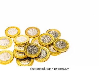 New one pound coins on a white background
