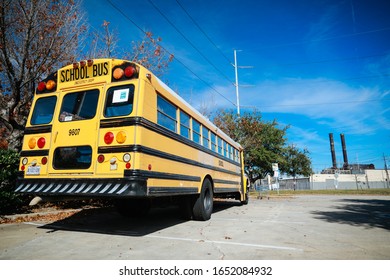 New Orlean,Luisiana,USA,2 December 2019:Empty yellow classic school bus on the street in New Orlean in sunny day.
