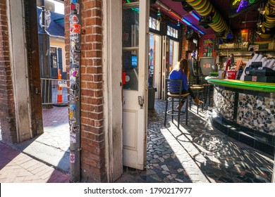 New Orleans - 04/15/2018 : Girl Sitting In Interior Of A Bar