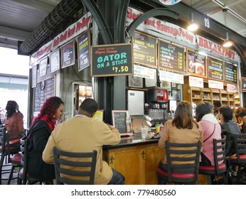 NEW ORLEANS, LOUISIANA—JANUARY 2017: Hungry Diners Eat At A Food Stall At The French Market, French Quarter In New Orleans On A Cold Day.