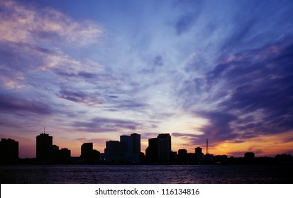 New Orleans City Skyline Silhouetted Against A Blue Sunset