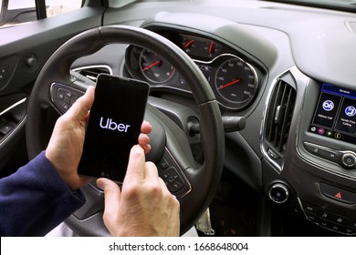 New Orleans - December 28, 2019: 
Hand holding smartphone with Uber ridesharing app displayed