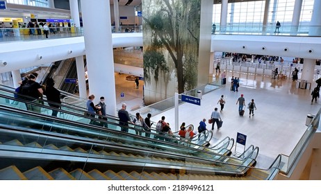 New Orleans - December 30, 2022:
Louis Armstrong International Airport Passengers Descending Escalator On Way To TSA Security Check Point