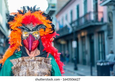 NEW ORLEANS - FEBRUARY 9, 2016: People Enjoy Mardi Gras Parade Wearing Carnival Mask. Mardi Gras Is The Biggest Celebration In The City