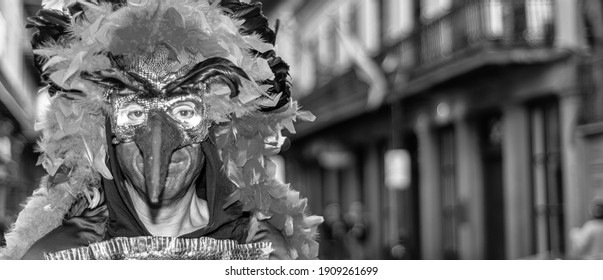 NEW ORLEANS - FEBRUARY 9, 2016: People Enjoy Mardi Gras Parade Wearing Carnival Mask. Mardi Gras Is The Biggest Celebration In The City