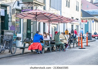 New Orleans, LA - Circa January 2022: People Eat Outdoors On The Street And Sidewalk At A Po Boys Restaurant On Bourbon Street In The French Quarter.