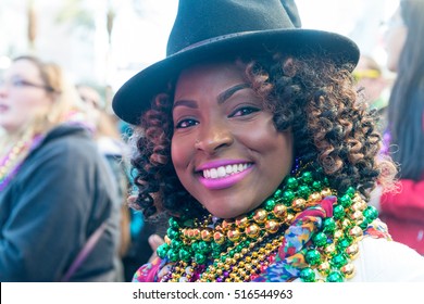 NEW ORLEANS, LA - FEBRUARY 9, 2016: Party People In Costumes And Masks Parade Through The Streets Of The New Orleans French Quarter On Mardi Gras Day.