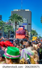 NEW ORLEANS, LA - FEBRUARY 9TH, 2016: Locals And Tourists Enjoy Carnival Parade Along Bourbon Street On A Sunny Day. It Is The Biggest Celebration The City Hosts Every Year