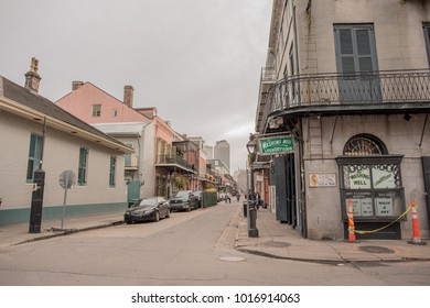 New Orleans, LA, January 24, 2018: Street Scene In The French Quarter - The Washing Well Laundry On Bourbon Street, Which Is Empty On A Cloudy, Winter Day.