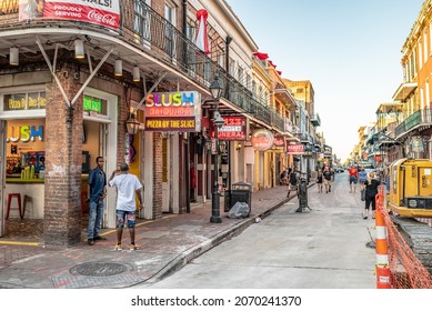 New Orleans, LA - October 25, 2021: People Stand On The Corner On Bourbon Street In The French Quarter.