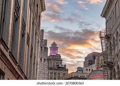 New Orleans, LA - October 28, 2021: The City Skyline Visible In The Distance At Sunset From Bourbon Street In The French Quarter.