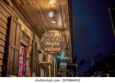 New Orleans, LA - October 28, 2021: Sign at the entrance to the famous Marie Laveau's House of Voodoo shop, on Bourbon Street in the French Quarter.